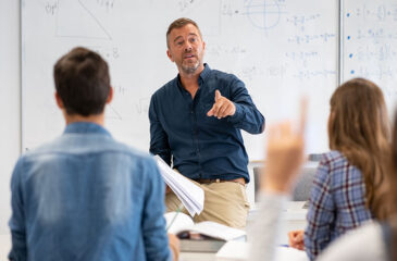 student raising hands