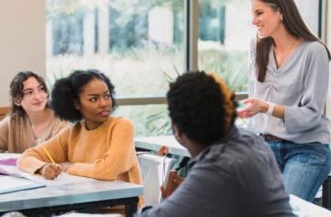 students talking to adult