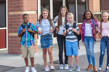 kids in front of school