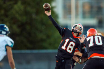 football player throwing ball