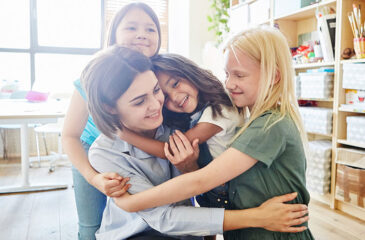 student embracing teacher